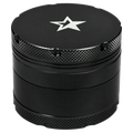 Close-up top-down view of the Famous X 4 pc Grinder -Black - 50mm showing its matte black lid with a silver star logo and textured knurled edges.