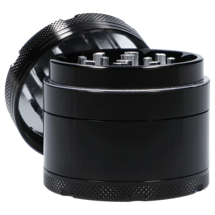 Close-up angled shot of the Famous X 4 pc Grinder -Black - 50mm showing the open top teeth and textured black outer ring.