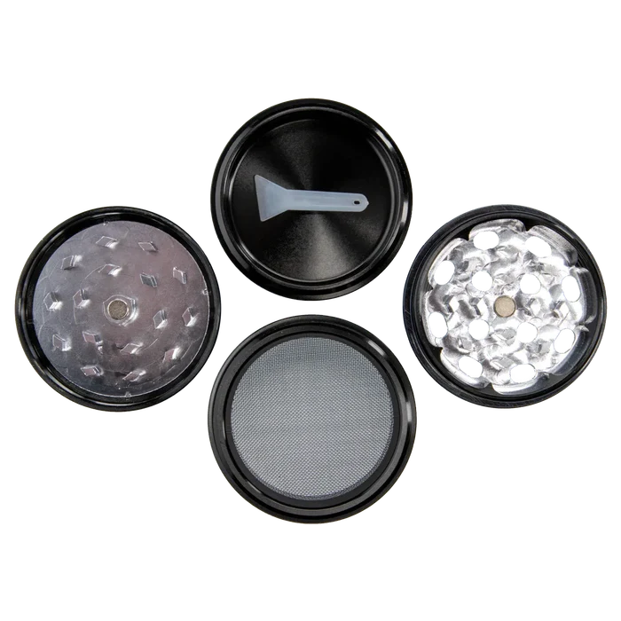 Top-down view of the opened Famous X 4 pc Grinder -Black - 50mm showing four circular sections including a lid with a small plastic scraper, two toothed grinding plates, and a fine mesh screen.