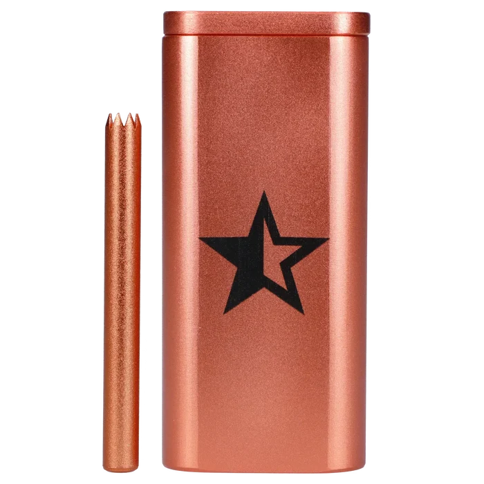 Close-up front view of the Famous X Aluminum Dugout - Rose Gold showing its metallic rose-gold finish, black star logo, and matching bat against a white background.