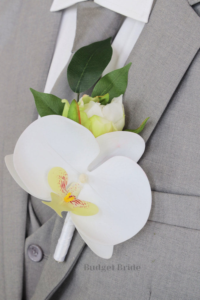white orchids grooms lapel boutonniere