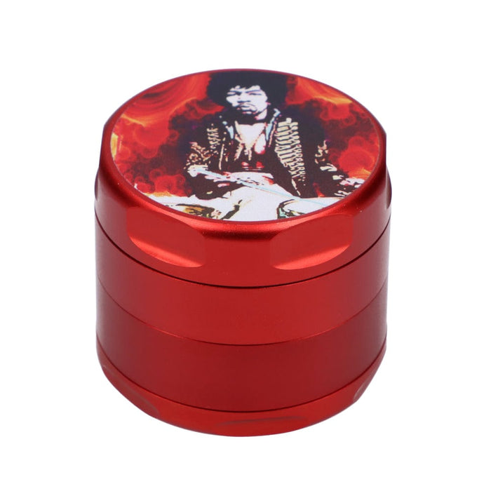 Front view of the Rock Legends Jimmy-Red Fire Grinder, a red, four-piece metal grinder with detailed imagery on the top.