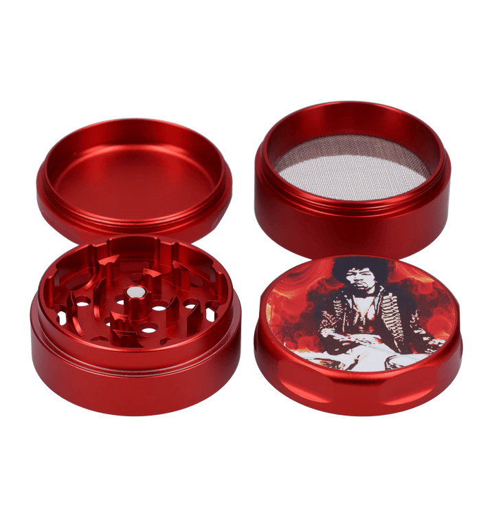 A close-up, angled view of the Rock Legends Jimmy-Red Fire Grinder, featuring a red metallic finish and intricate detailing.