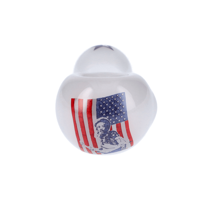 A white, angled studio shot of the Rock Legends Jimmy-USA Spoon Pipe, displaying its smooth, curved design.