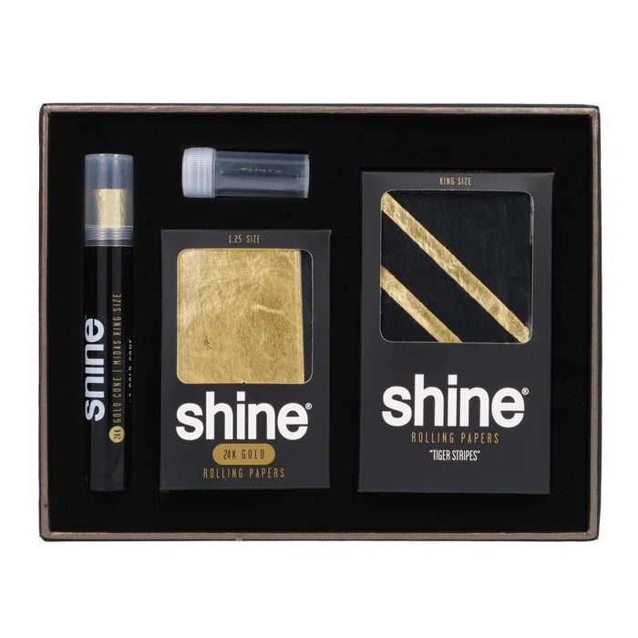 Front view of the Shine Papers-Launch Pack, showcasing a gold and black packaging design with visible branding details.