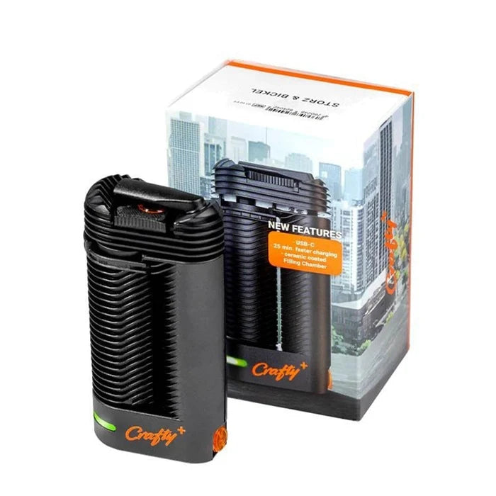 Front view of the Storz & Bickle Crafty Plus Portable Vaporizer, showcasing its sleek, black design against a blurred background.