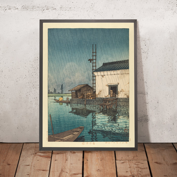A framed image of Ushibori in the Rain by Hasui Kawase, 1935